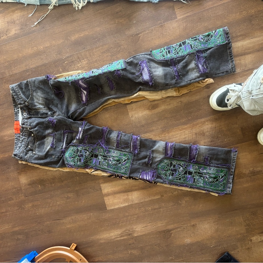 Who Decides War Distressed Black Jeans with Green and Purple Accents